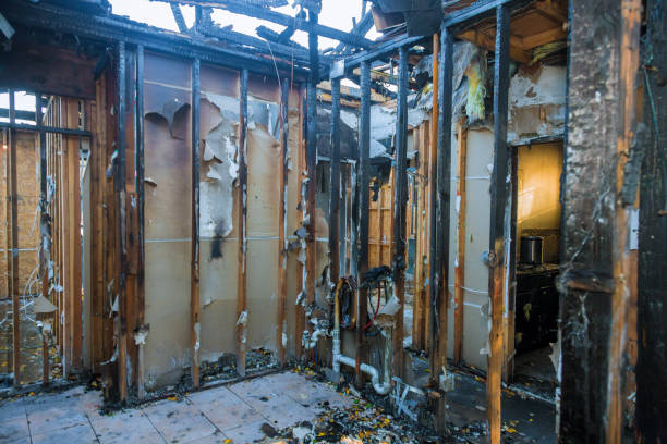 Professional Fire Damage Restoration technician working in Melrose, MA
